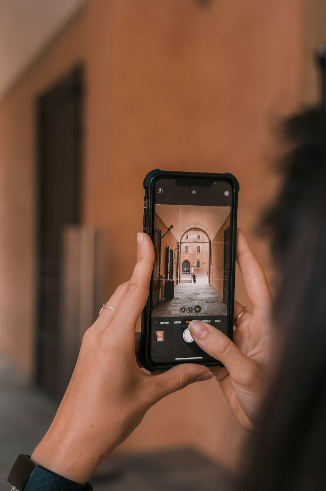 Young Uruguayan influencer recording content with smartphone